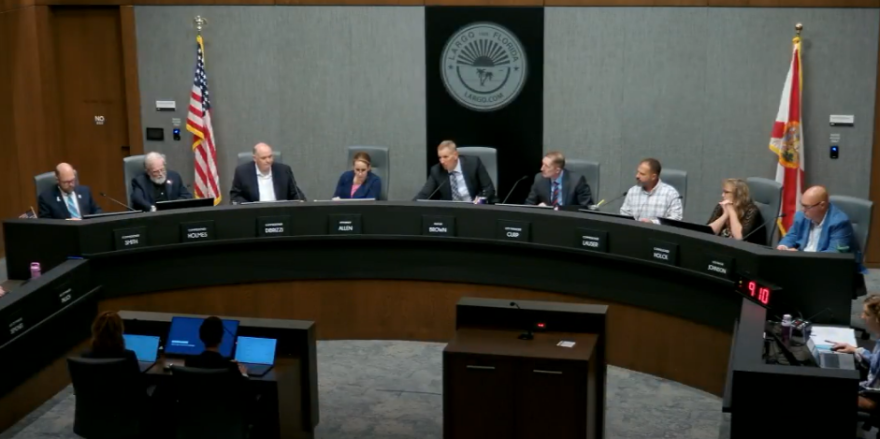 People sitting around a dais
