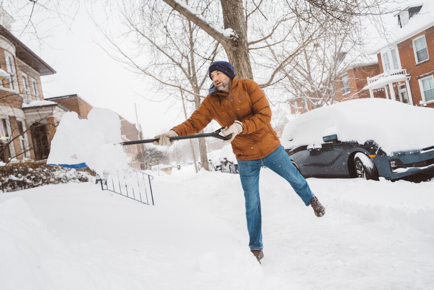 Kevin Toben shovels several inches of snow from around his van outside of his home on Sunday, Jan. 25, 2026, in St. Louis’ Shaw neighborhood. “My kids like to make snowmen and snow forts, so I wanted to make sure they got a good big pile so they would have plenty of material to play with,” he said. “I just want to be prepared this time to shovel up the best I can.”