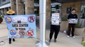 Yuma County residents protest data centers outside a meeting of the Greater Yuma Economic Development Corp. on Friday, April 10, 2026. The majority of protesters went inside the meeting as it was opened to the general public.