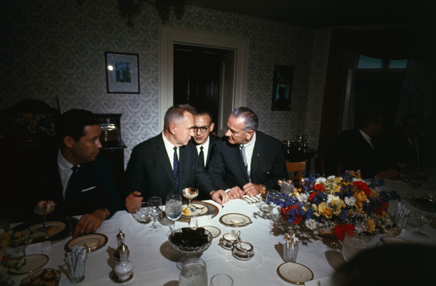 Soviet Premier Aleksei Kosygin (left) and President Lyndon B. Johnson confer during a luncheon at what was then known as Glassboro State College in New Jersey in 1967. An interpreter sits between them.