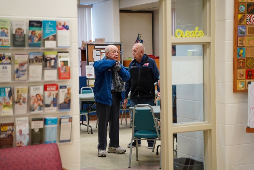 Bernie Puchajda (right) talking with close friend Frank Lovell (left) right after a game of chair volleyball at the Donna Smallwood Activities Center.