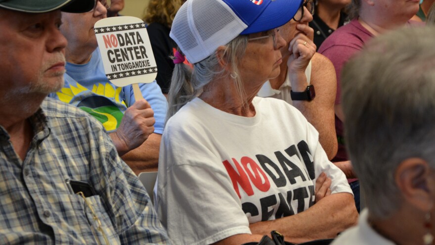 Protesters used their "no data center in Tonganoxie" signs and shirts to show their opposition for the proposed data center.
