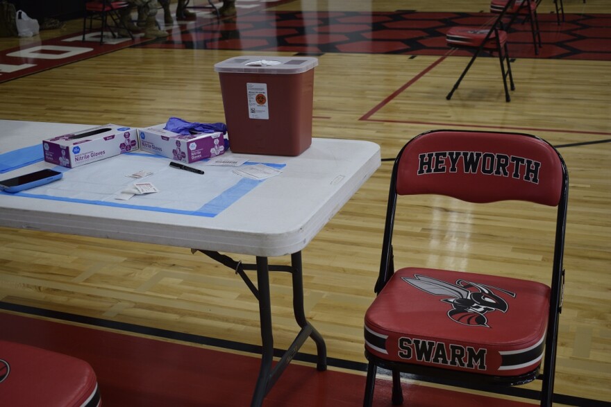 Empty chair next to table in gymnasium