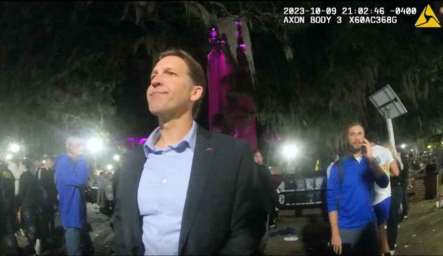 University of Florida President Ben Sasse speaks to campus police Oct. 9, 2023, as seen on newly released body camera video, after a a panicked stampede during a nighttime vigil on campus for Israelis killed in Hamas attacks. Sasse was speaking at the vigil and witnessed the chaos. Police later concluded the students panicked because a woman in the crowd had fainted and her boyfriend shouted for others to call 911, not because of gunfire or an explosion. (University of Florida Police Department/Fresh Take Florida).