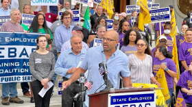 Rob Baril, the president of SEIU 1199, says state employees deserve raises. Behind him to the left is Sal Luciano, president of the state AFL-CIO.