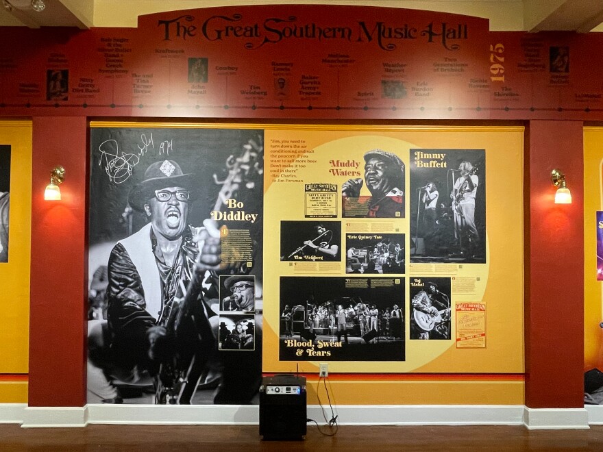 The exhibit includes photographs of various celebrated artists during their performances at the Great Southern. “The music was the soundtrack of our lives, and it was just such objectively outstanding music,” said John Moran, who took the featured photos while working at the venue as a UF student. (Benjamin Crosbie/WUFT News)