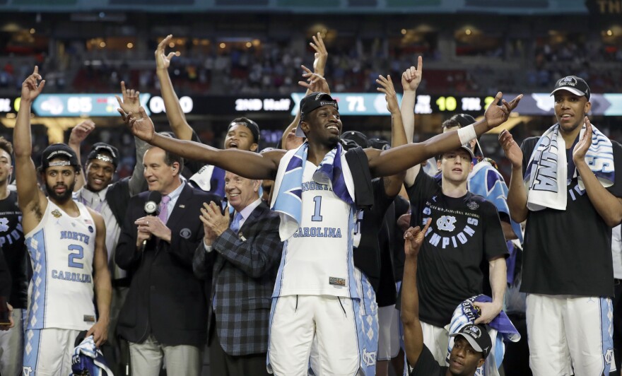 North Carolina's Theo Pinson (1) and the rest of the team celebrate after the finals of the Final Four NCAA college basketball tournament against Gonzaga, Monday, April 3, 2017, in Glendale, Ariz. North Carolina won 71-65.