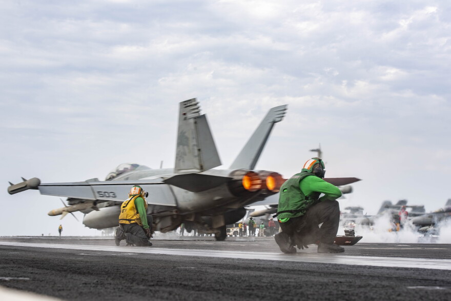 An E/A-18G Growler, attached to the "Zappers" of Electronic Attack Squadron (VAQ) 130, launches off of the flight deck of USS Dwight D. Eisenhower in the Red Sea.