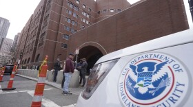 FILE - A Homeland Security vehicle, right, is parked outside the Moakley Federal Courthouse, April 19, 2023, in Boston. . (AP Photo/Steven Senne, File)