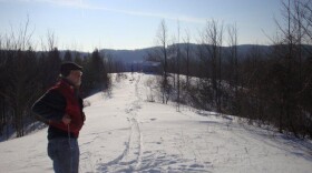 Steve Smiley, project manager for the Northport turbine, on the ridge where the windmill will be built.