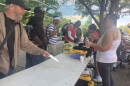 People line up for meals and beverages outside Richland Library Main in Columbia.