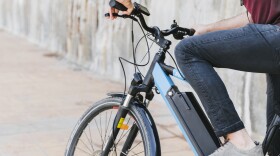 Close up man riding an e-bike