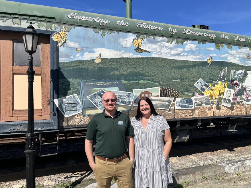 Cain Chamberlain, left, executive director of the Endless Mountains Heritage Region, and Robyn Cummings, executive director of the Bradford County Tourism Promotion Agency, stand at the start of the Endless Mountains Grand Depart in Towanda.