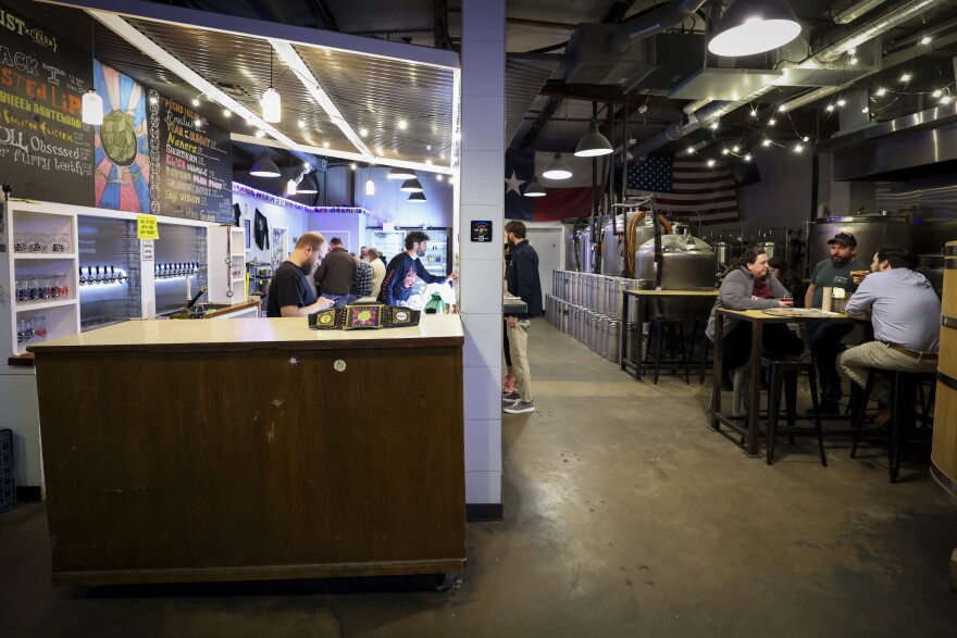 Patrons enjoy brews in the taproom Thursday, Jan. 16, 2025, at Division Brewing in Arlington.