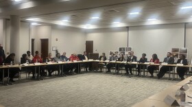 Attorney General Andrea Campbell [right] with members of her office listening to organizer Katie Talbot [left] and activists speak about significant housing violations at Springfield Garden.