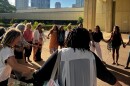 The plaintiffs — six midwives and three mothers — form a circle with their supporters to chant a pule, or prayer, before heading into court. (June 10, 2024)