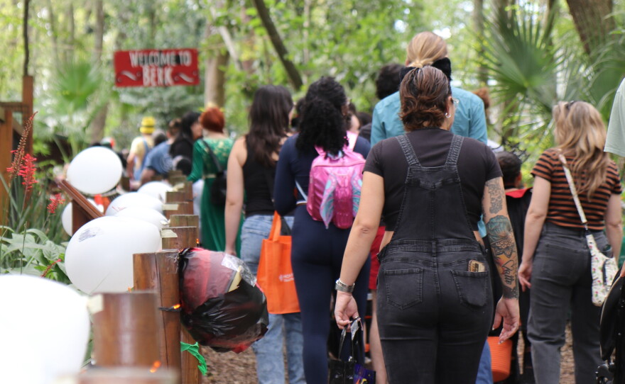 Families line up to enter Berk in the “How to Train Your Dragon” zone of Boo at the Zoo on Wednesday, Oct. 28, 2026. The zoo was filled with families navigating the one-way trick-or-treating path. Boo at the Zoo has welcomed over 140,000 visitors in its 30 years, according to Santa Fe College Teaching Zoo director Jonathan Miot. (David Caine/WUFT News)