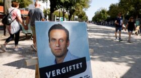 A poster with a picture of Russian opposition leader Alexei Navalny with the headline "poisoned" is seen outside the Russian embassy on Unter den Linden in Berlin during an anti-government protest.