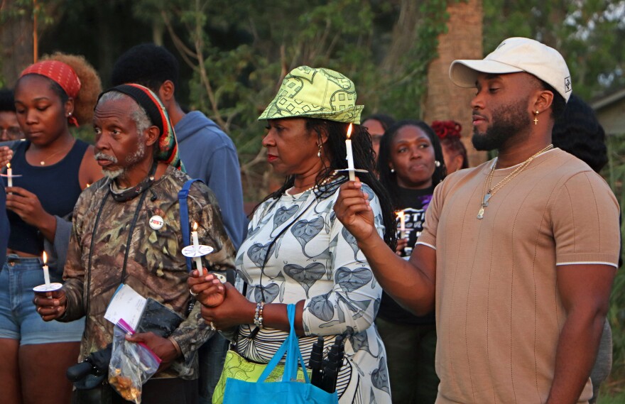 Gainesville residents mourn the life of Ajike "AJ" Owens at a vigil at the GNV Bridge Community Center on Wednesday. (Amanda Friedman/WUFT News)