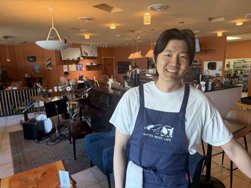 Owner Sean Dokko poses inside Butter Notes Cafe.