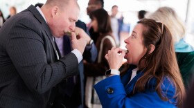 Del. Michael Webert, R-Fauquier, competes along Del. Shelly Simonds, D-Newport News, in a friendly oyster eating contest during a General Assembly session on Wednesday, February 5, 2025 at the General Assembly Building in Richmond, Virginia.
