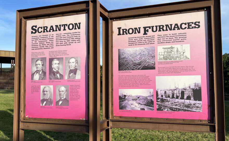 Signs detailing the history of the Scranton Iron Furnaces are located at the site.