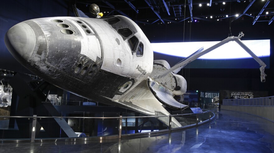 The space shuttle Atlantis, with its cargo arm extended, goes on display today the Kennedy Space Center Visitor Complex in Cape Canaveral, Fla.