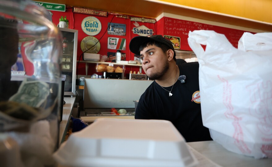 Server Derek Castillo handles the Sunday morning breakfast rush at 16th Avenue Diner in Gainesville, Fla. on Sunday, Nov. 16, 2025.
