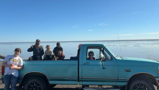 June Ingram at the wheel, alongside her family at her set net site in Ekuk, which was first staked by her grandfather in 1939.