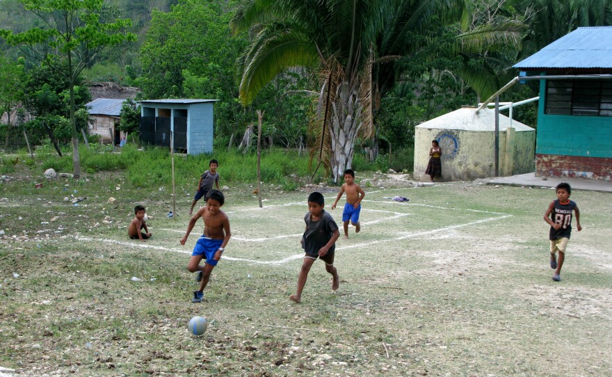 Football on a makeshift field in Limon, Guatemala.