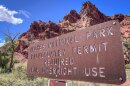 A sign at the boundary of Arches National Park in southeast Utah, Aug. 19, 2024. After four years of requiring visitors to get a timed-entry permit, the park will now allow people to enter without a reservation.