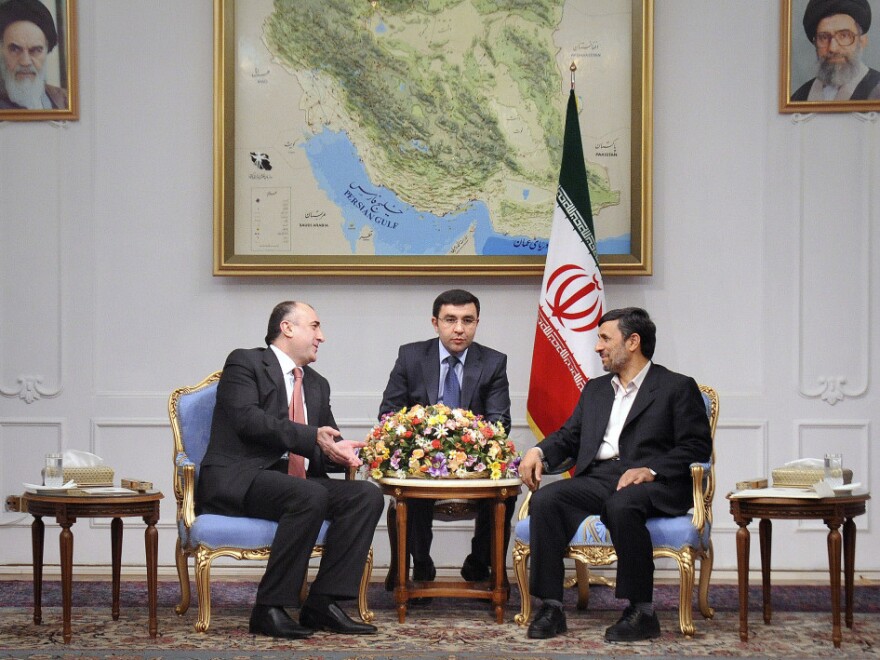 Iranian President Mahmoud Ahmadinejad (right) meets with Azerbaijan's foreign minister, Elmar Mammadyarov (left) in Tehran in March 2011. Tensions have been growing between the countries, including a recent incident in which Tehran summoned the Azerbaijani ambassador to protest alleged Israeli intelligence activity in Azerbaijan.