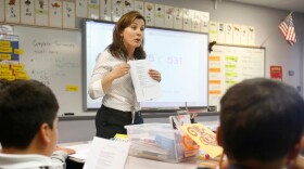 FILE - In this June 12, 2013 file photo second-grade teacher Vickie Boudouris goes over a an English work sheet with her students at the Cordova Villa Elementary School, in Rancho Cordova.
