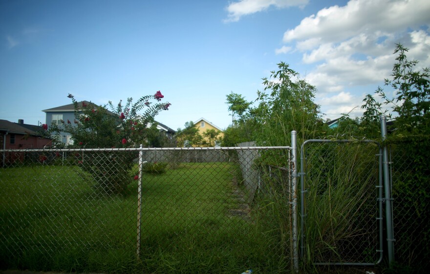 Where houses once stood there are now just empty lots and overgrown gardens in the 7th Ward of New Orleans. It's known here as the "jack-o'-lantern syndrome": A rebuilt house represents the teeth; a weedy lot, the gaps between them.