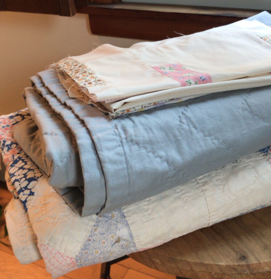Emma's great-grandmother's handmade quilt, her own and early quilt pieces from her current work-in-progress.