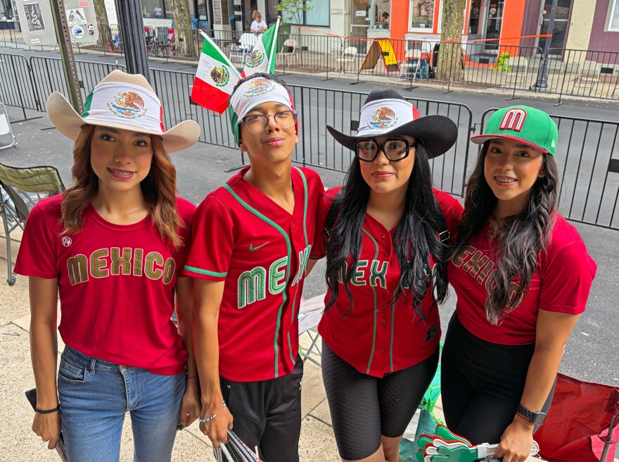 Members of the Nunez family from Mexico gather on West Fourth Street, Williamsport, Tuesday afternoon ahead of the 2026 Grand Slam Parade. Their cousin, Tadeo Paez, is playing on this year's Mexico Region team at the Little League World Series. The family traveled to Northcentral Pennsylvania from Tijuana by way of San Diego, Detroit and New York, where they rented a car for the remainer of the journey.