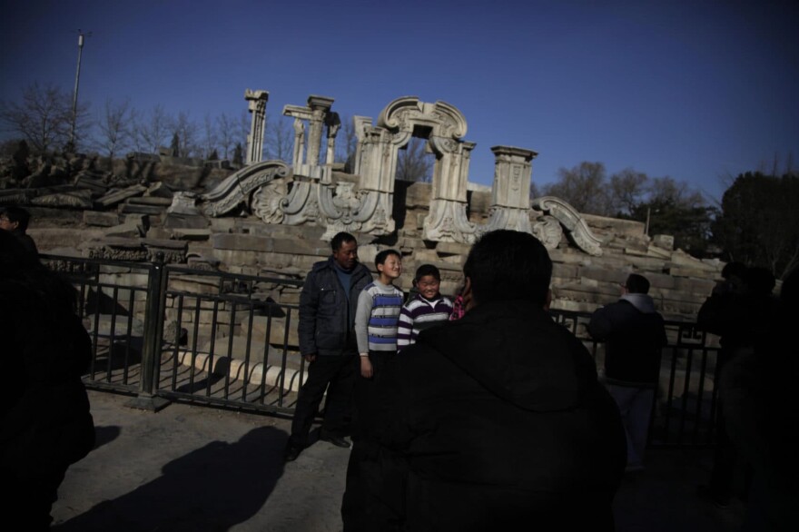 A family visits the ruins at the Old Summer Palace during the fourth day of Chinese new year in Beijing, China, Sunday, Feb. 6, 2011. (Ng Han Guan/AP)