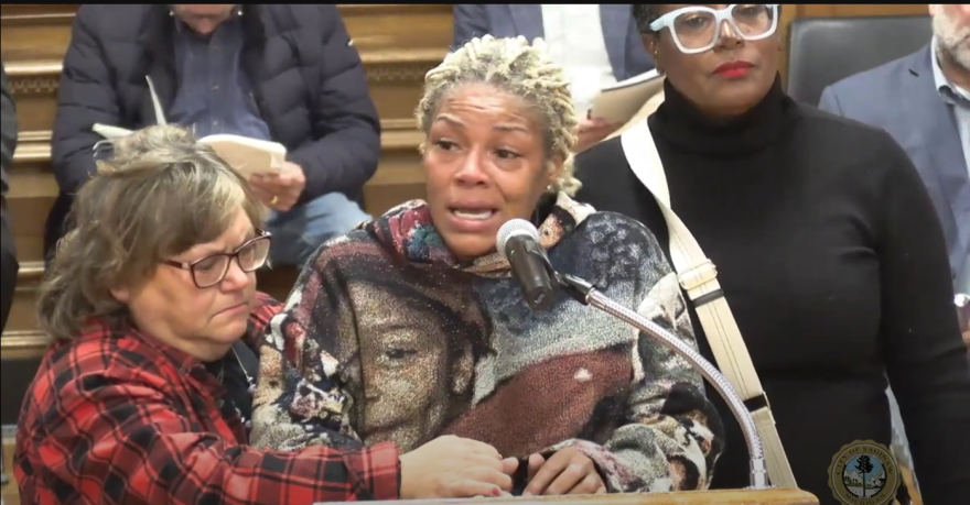 Tiffany Owens (center) testifies at a Saginaw City COuncil