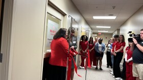 Bradley University Dean College of Education and Healthcare Sciences Dr Jessica Clark cuts the ribbon in front of the new Nursing Simulation Suite in its grand opening on Friday, Sept. 29