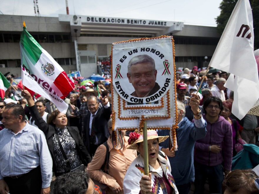 Supporters await the arrival of presidential candidate Andres Manuel López Obrador at a Mexico City rally last month.