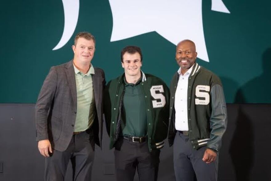 Cheli with MSU Hockey Coach Adam Nightengale and former MSU Athletic Director Alan Haller.