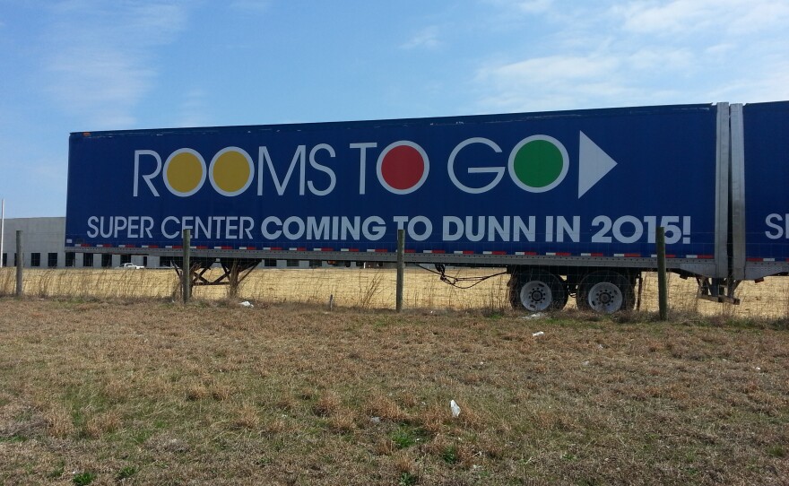 A Rooms To Go billboard.