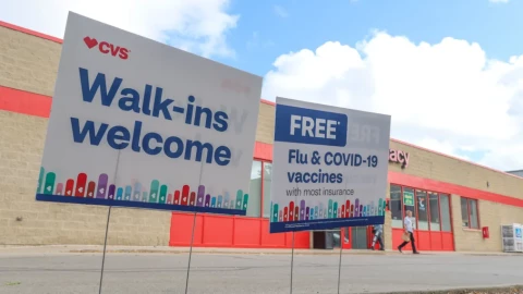 Signs advertise autumn vaccinations at a pharmacy in Chicago.