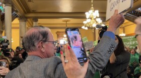 Gov. Mike Braun waded into a crowd rallying at the Statehouse to speak about property tax relief on March 17, 2025.
