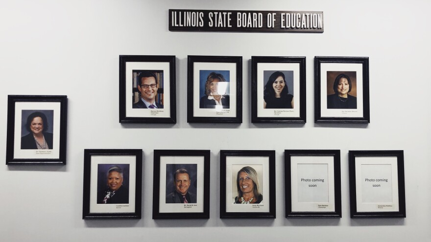 Wall of framed board member head shots