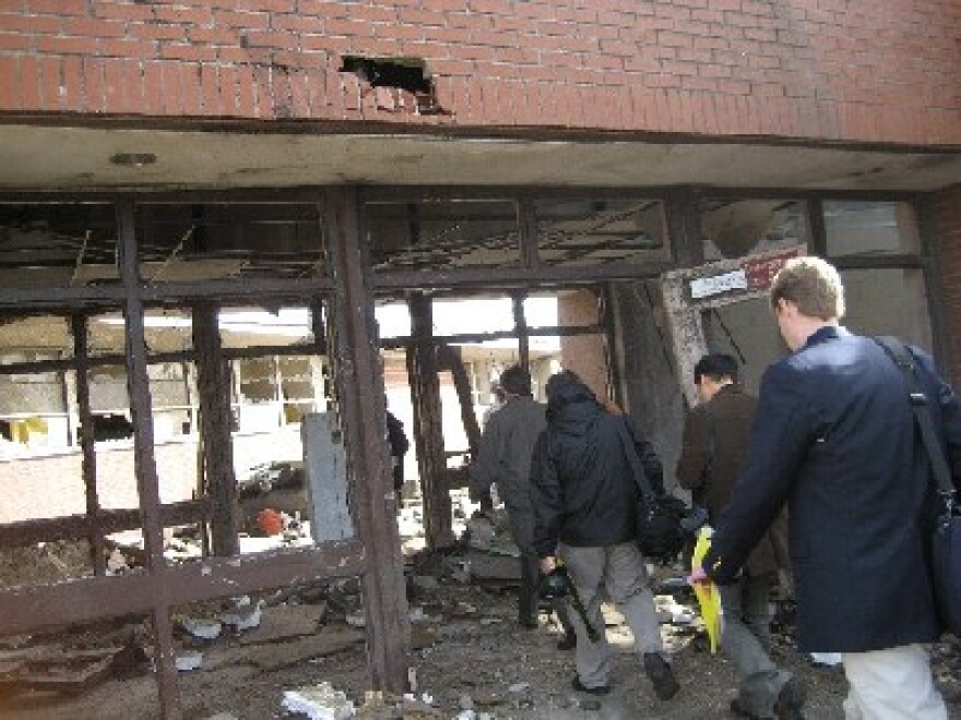 APR Reporter Kristen Taylor took this photo of fellow journalists and other officials entering a damaged part of Enterprise High School on March 2, 2007.