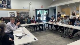 Hickenlooper responds to questions from a constituent during a meeting in El Jebel on June 27, 2024.