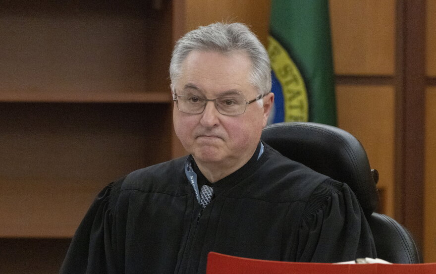 Pierce County Judge Bryan Chushcoff looks at attorneys in the Manny Ellis case before reading the verdict in Pierce County Superior Court Thursday, December 21, 2023. The three officers who were accused, Timothy Rankine, Christopher "Shane" Burbank and Matthew Collins were all found not guilty.