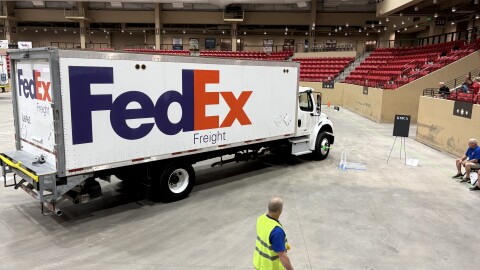 A volunteer watches as a driver completes the course at the state truck rodeo. The event was held at the Kansas Star Casino's indoor arena.