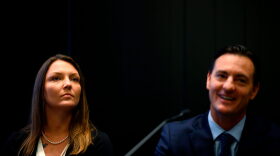 Courtney Wild (L), who claims she was abused by Jeffrey Epstein when she was a minor, and her lawyer Brad Edwards attend a news conference in New York City.